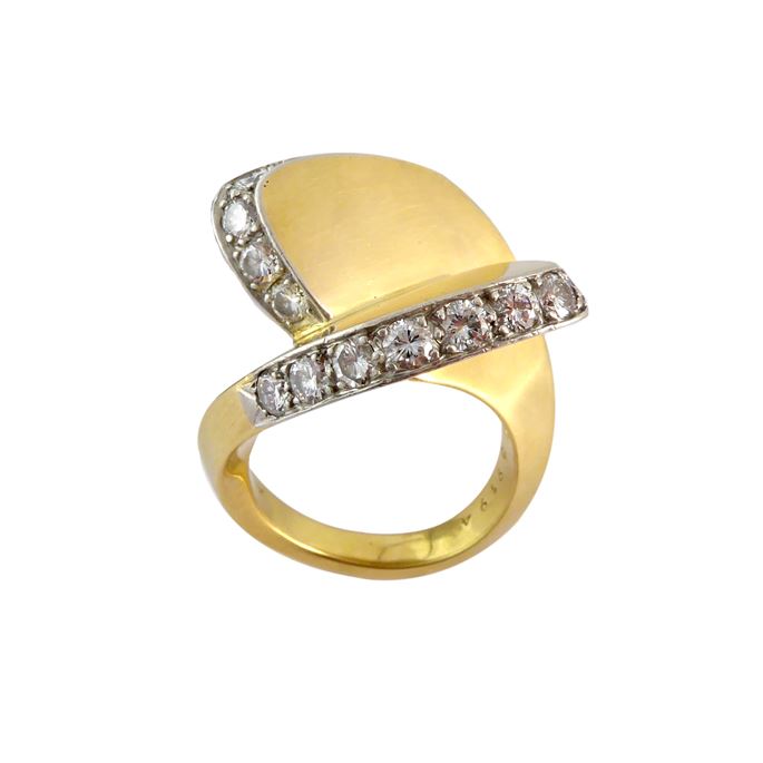 Gold and diamond split scroll ring by Cartier, of crossover design, formed by two interlocking gold upward panels, | MasterArt